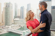 © phocal Media - Couple embracing at balcony.