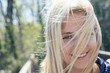 © Laszlo - Carefree woman with long hair in her face. Windy weather concept.