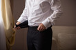 © Wedding photography - Elegant man dresses cummerbund