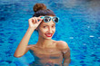 © Loginova - Relaxation and leisure. Beautiful young woman enjoying suntan in resort swimming pool.