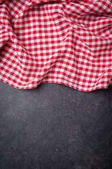 Wall Mural - Red folded tablecloth on gray stone table. Food background