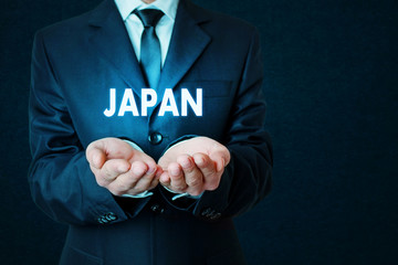 Wall Mural - Businessman holding Japan word