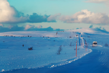 Wall Mural - Road at winter tundra. Kola Peninsula, Russia