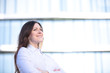 © PhotoStar - Portrait of a successful business woman smiling. Beautiful young female executive in an urban setting