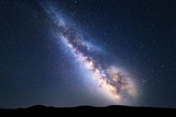 Fototapeta Kosmos - Milky Way. Colorful night landscape with bright milky way, starry sky and hills in summer. Space background. Amazing astrophotography. Beautiful universe. Travel
