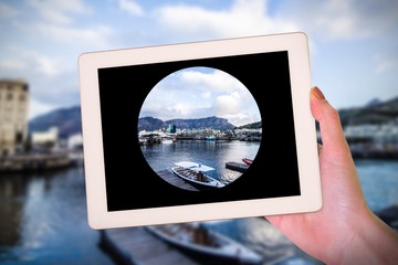 Poster - Composite image of feminine hand holding tablet