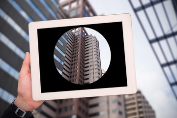 Poster - Composite image of masculine hand holding tablet