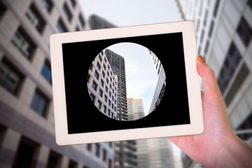Poster - Composite image of feminine hand holding tablet