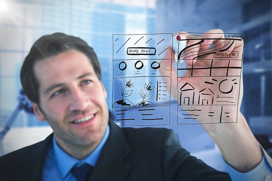 Composite image of businessman writing with red marker  