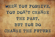 Inspiring motivation quote of when your forgive, you don't change the past, but you do change the future with typewriter text. Distressed Old Paper with Typing image.