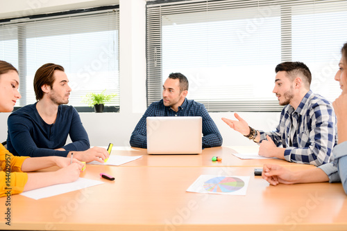 Fotografie, Obraz young casual and dynamic new business people team man and woman discussing on in