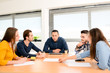 © W PRODUCTION - young casual and dynamic new business people team man and woman discussing on informal meeting with the company manager in office
