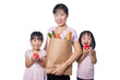 Leinwandbild Motiv Asian Woman and daughters carrying groceries