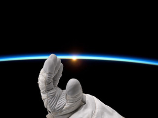 Wall Mural - astronaut reaching for the sunrise
