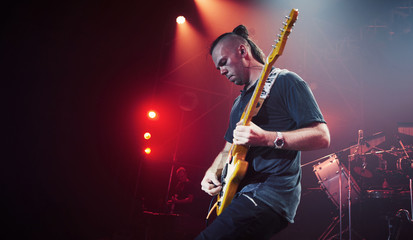 Guitarist performing on stage. Concert.