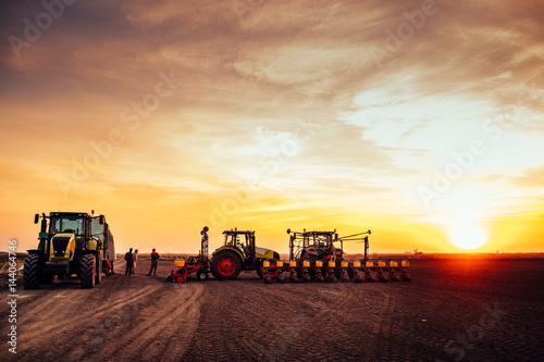 Fényképezés Agricultural mechanization on sunset