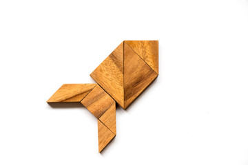 Wall Mural - Wooden tangram puzzle in rocket shape on white background (Concept for new experience, start project)