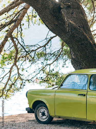 Fotografia Lazy Yugoslavian retro car in Perast, Montenegro.