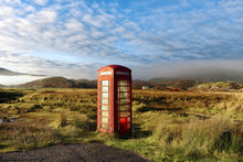 Autumn View Of A Red Telephone Box At The Side Of A Quiet Road In The Remote Misty Ardnamurchan Moors Of The Scottish Highlands, Scotland