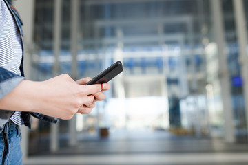 Woman using mobile smartphone. Modern or artistic concept. Close-up smartphone approach.