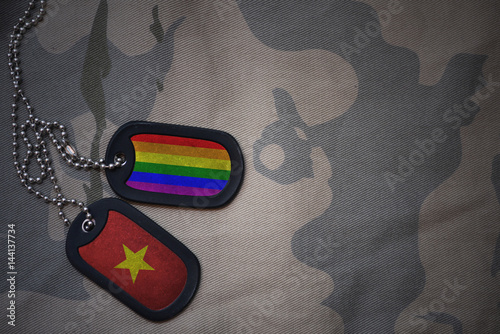 Stampa su Tela army blank, dog tag with flag of vietnam and gay rainbow flag on the khaki texture background