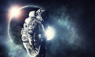 Wall Mural - Astronaut in outer space. Mixed media . Mixed media