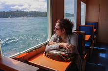 Thinking Woman Looking On The Sea From Ferry Boat Window