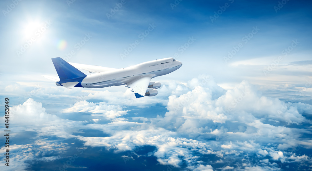 Airplane flying above clouds - obrazy, fototapety, plakaty 