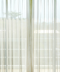 Close up of a white net curtain in detail