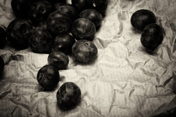 Wall Mural - Fresh blueberries on a rustic brown paper background