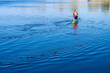 Woman paddling with canoe on the blue river on a sunny day. Young women canoeing. Kayak. People kayaking in the river Dnieper. 
