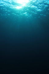 Underwater blue ocean background with sunlight 