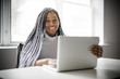 © Louis-Paul Photo - teen at desk in her office with laptop