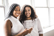 © Louis-Paul Photo - Two young afro girls having fun together