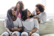 © Louis-Paul Photo - Two family Friends Sitting On Sofa Together