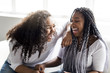 © Louis-Paul Photo - affectionate friends afro american sitting on sofa