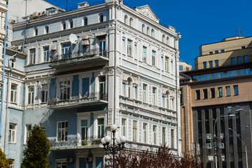 Beautiful house in a classic style and reflected in a puddle. Kiev, Ukraine