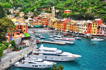The Beautiful Portofino With Colorful Houses And Villas, Luxury Yachts And Boats In Little Bay Harbor. Liguria, Italy, Europe