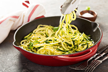 Wall Mural - Spiralized zucchini noodles in a cast iron pan