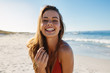 © Jacob Lund - Smiling young woman on the beach