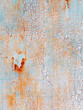Abstract blue orange texture with grunge cracks. Cracked paint on a metal surface. Bright urban background with rough paint transitions. The cracks grunge urban background. 