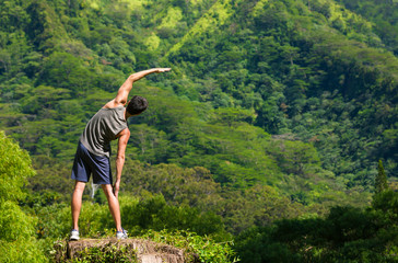 Active healthy lifestyle concept. Fit male doing warmup stretch before workout.  