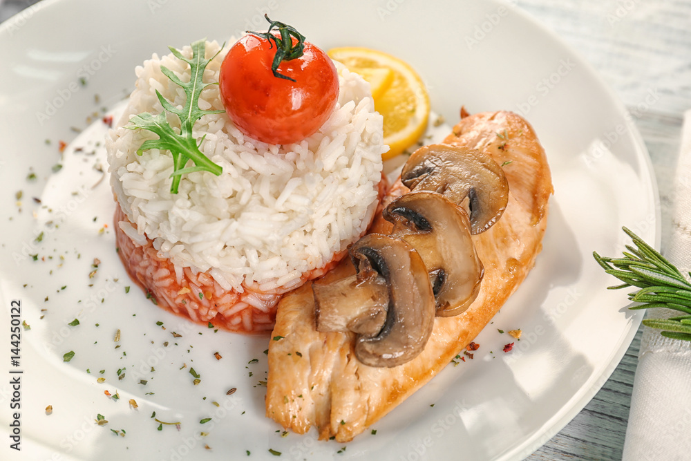 Plate with chicken breast and rice, closeup