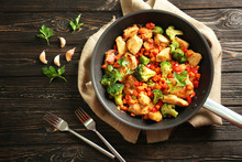 Chicken Stir Fry With Cutlery And Spices On Table