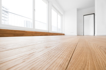 empty room, wooden floor in new apartment