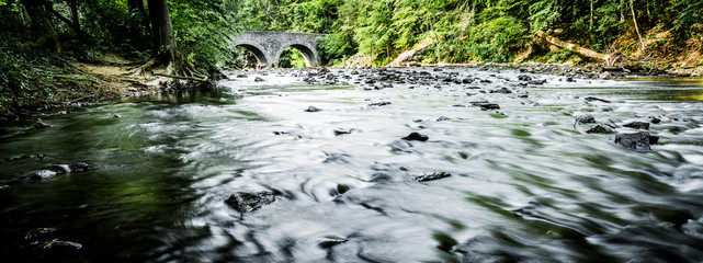 Flowing creek and bridge, outside of Philadelphia, PA