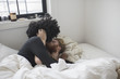 © HEX - A young couple kissing in bed