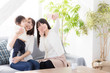 © taka - young asian family taking photo in living room
