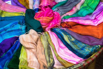 Stack of colourful silk scarfs