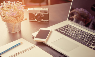 Creative blogger office with equipment in vintage tone